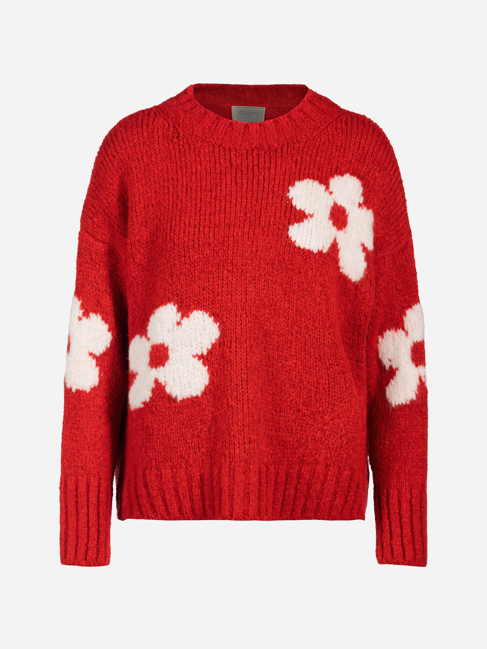 Ein leuchtend roter Strickpullover mit großen weißen Blumenmustern auf der Vorderseite, den Ärmeln und den Schultern, mit Rundhalsausschnitt und gerippten Bündchen und Saum.